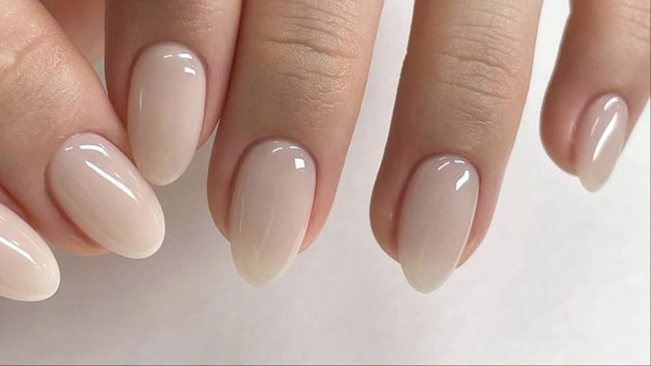 Almond-shaped nails with a glossy nude manicure at MK Nail Studio